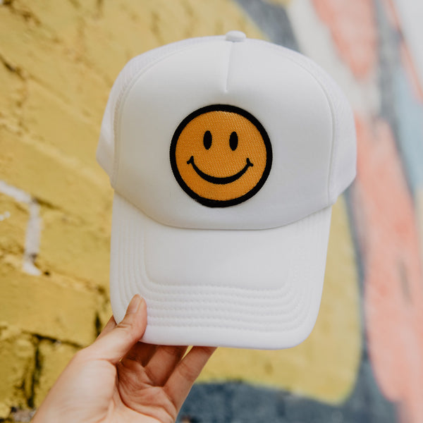 http://www.katydidwholesale.com/cdn/shop/products/smiley-face-trucker-hat-all-white_600x.jpg?v=1623361891