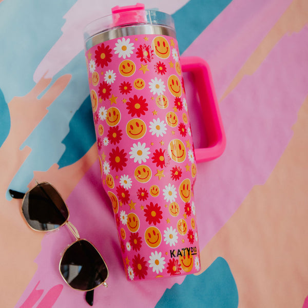 http://www.katydidwholesale.com/cdn/shop/products/stainless-steel-tumbler-smiley-face-hot-pink-floral_600x.jpg?v=1699998921